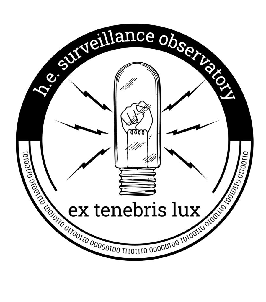 The higher ed after surveillance log is a clenched fist in an old fashioned lightbulb surrounded by lightning bolts. Below that is latin for "out of darkness comes light" and in binary around the edge it says "fire w fire."